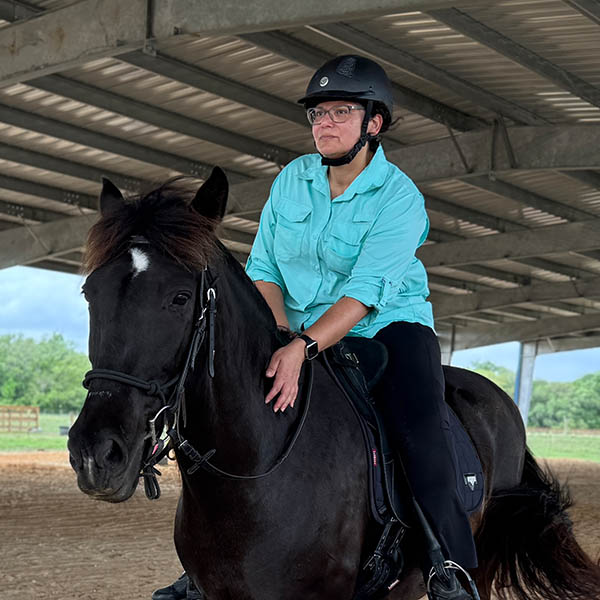 adult riders learn the basics of horse riding 