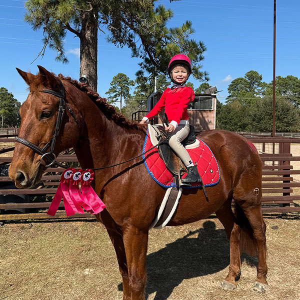 young rider wins horse riding trophy